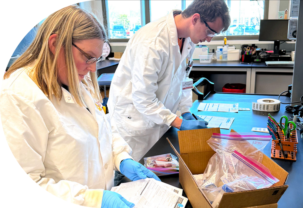 Iowa State Researchers wearing PPE while working in a Veterinary Diagnostics Laboratory
